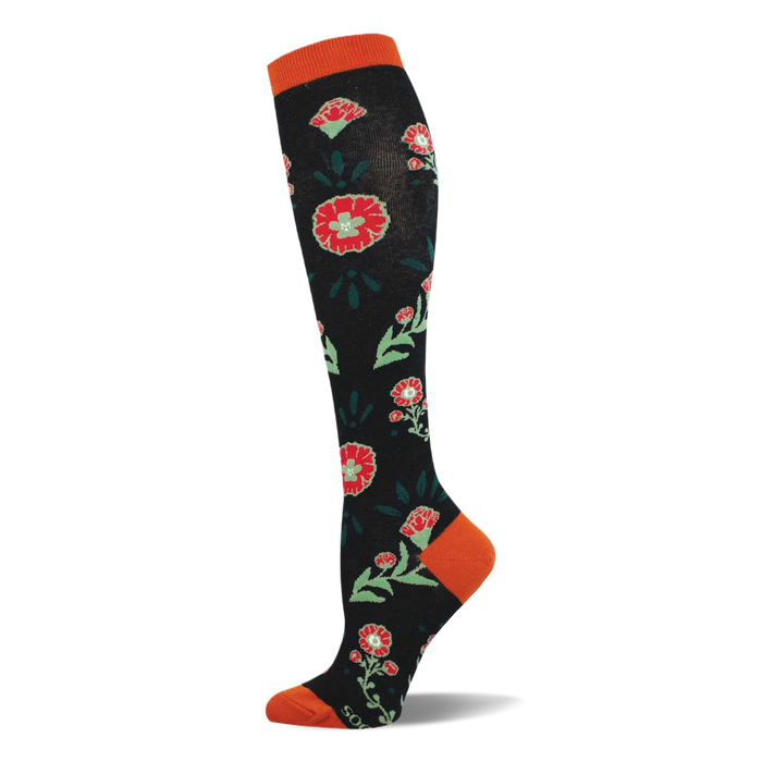 A knee-high black sock with a pattern of red flowers, light green centers, and dark green leaves. Features orange cuff, heel, and toe. }}
