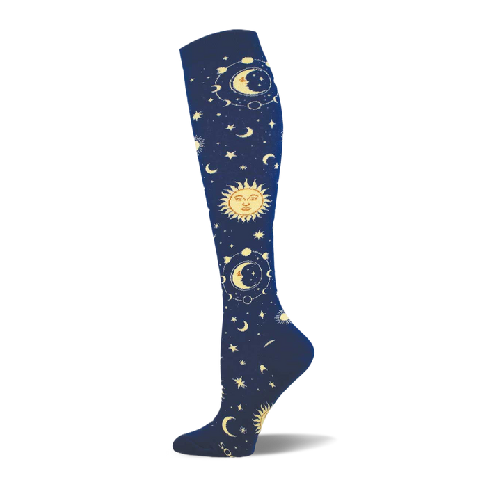 Knee-high sock in dark navy blue with an all-over pattern of golden suns, crescent moons, and stars with orbital rings. }}