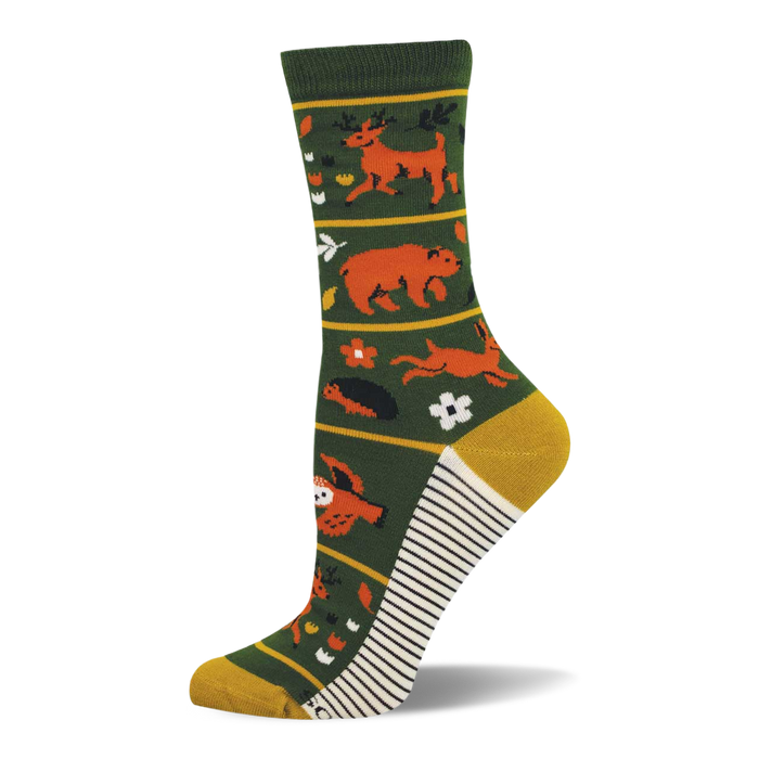 Dark green crew sock with orange deer, bear, rabbit, owl, and forest flora. Yellow toe/heel and white/black striped sole. }}