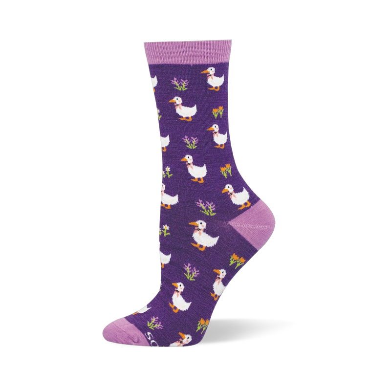 Dark purple bamboo sock showing white ducks in pink bowties mixed with small bright flowers and light purple accents.