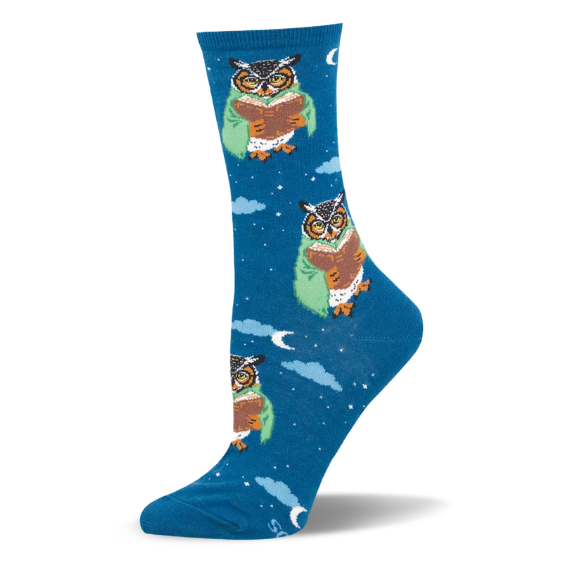 Deep blue crew socks featuring a pattern of owls wearing glasses and green blankets reading books among clouds and stars.