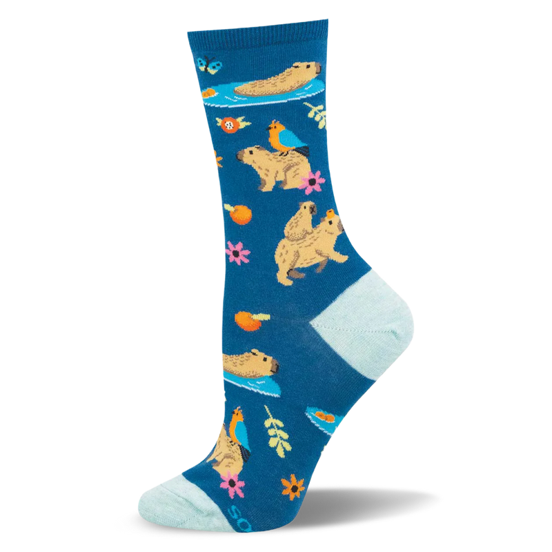 Teal crew sock patterned with capybaras swimming, carrying baby capybaras, birds, pink flowers, and orange slices.