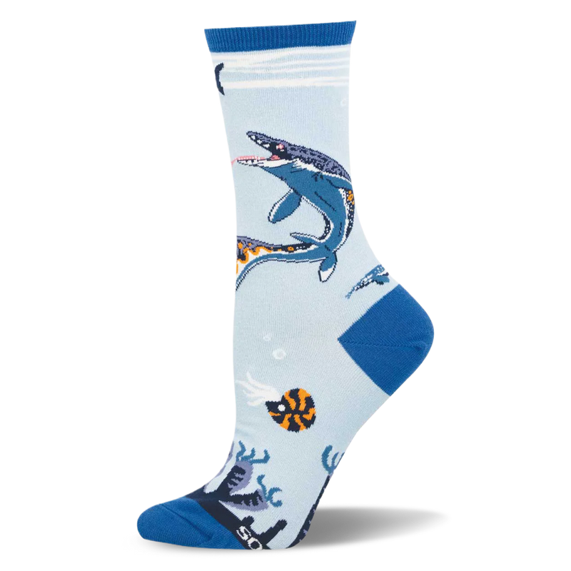 Light blue crew sock showing a swimming dark blue Mosasaurus, an orange ammonite, bubbles, and dark blue heel.