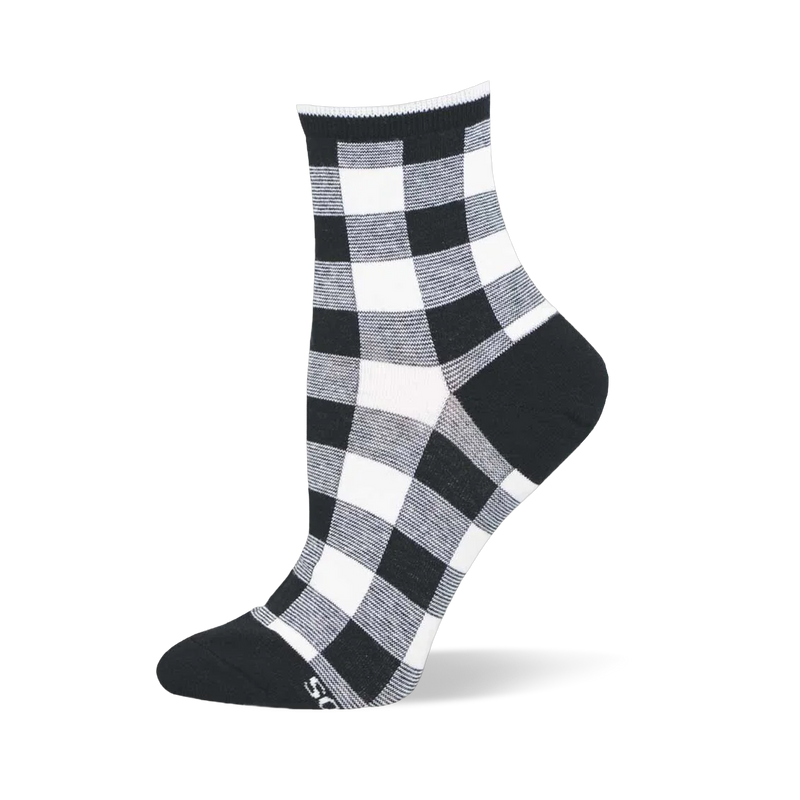 Short black and white gingham plaid sock with large squares, a solid black heel, solid black toe, and ribbed black cuff.