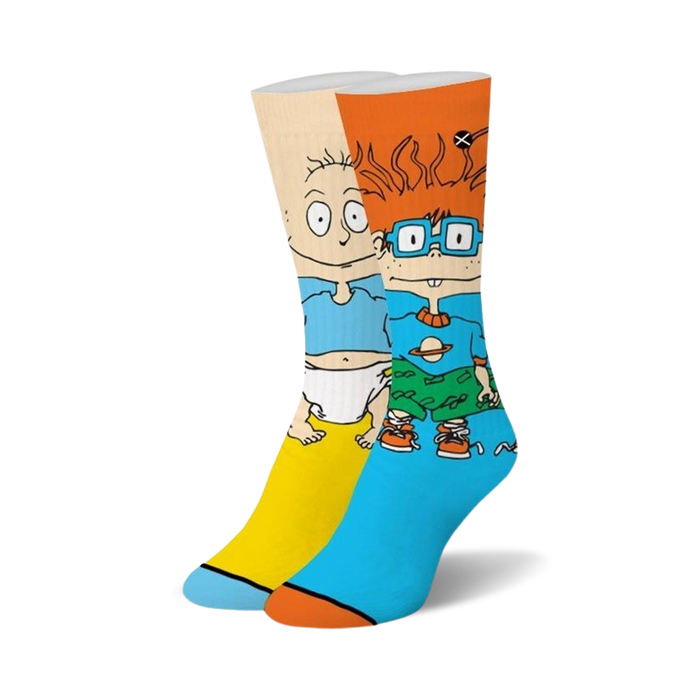 Pair of Rugrats crew socks. Tommy and Chuckie are featured in bright blue, yellow, and orange on a white background. }}