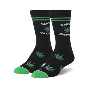 Pair of black crew socks with green marijuana leaf designs and 'Smoke Everyday' text. Green accents on the cuffs.