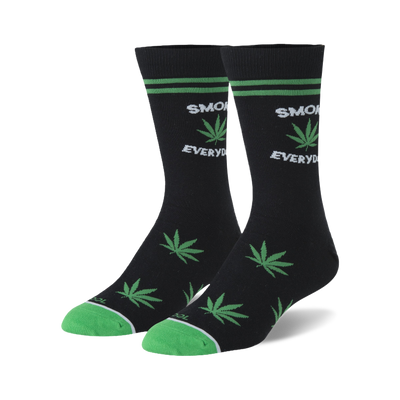 Pair of black crew socks with green marijuana leaf designs and 'Smoke Everyday' text. Green accents on the cuffs.