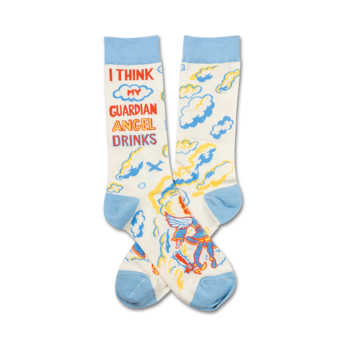 Cream crew socks with light blue cuffs, featuring a cartoon angel, clouds, and the text 'I think my guardian angel drinks'. }}