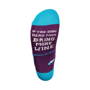 Close-up of the sock's heel, showing the text 'If you can read this, bring more wine' in a pixel font.