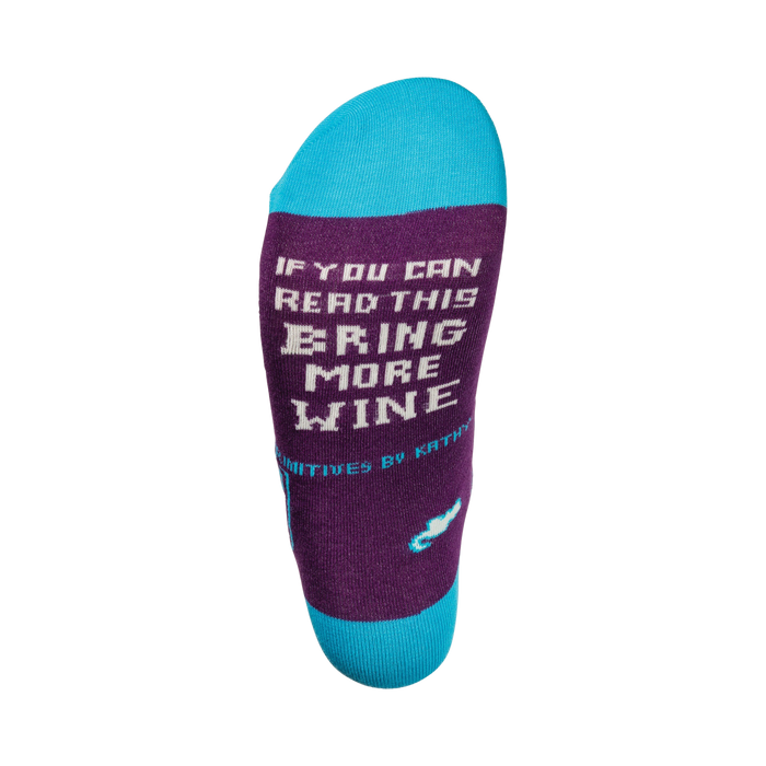 A pair of wine-themed socks with the message 