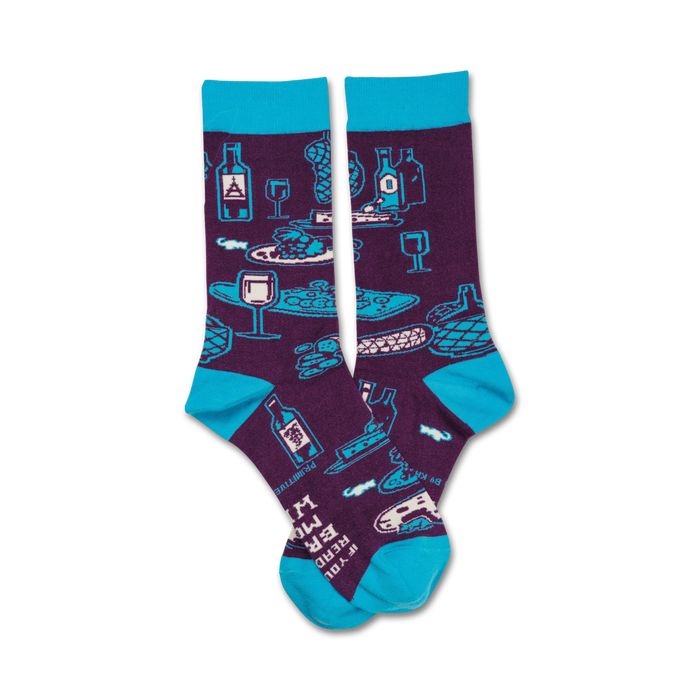 purple wine-themed crew socks with blue toes featuring a pattern of wine, cheese, bread, and grapes. text on bottom of toes reads, 