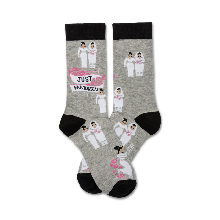 Pair of grey crew socks with black cuffs. Features repeating illustrations of two brides in wedding dresses and a 'Just Married' banner. }}