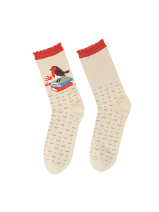 Lifestyle product shot showcasing a pair of cream socks with a robin design.