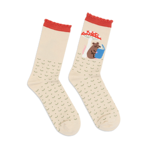 Cream crew socks with red accents. One sock features a mouse reading under a mushroom; the other is a repeating pattern.