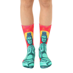 Pair of crew socks featuring a teal Buddha image on a red background with Om symbols.