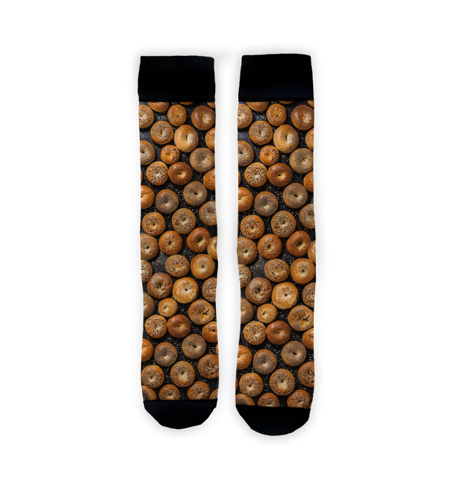Flatlay product shot of two Bagels 360 socks against a white background. The socks are positioned vertically, showing the full bagel print.