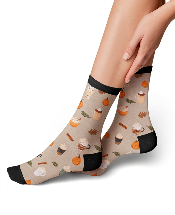 Lifestyle shot of a model wearing Pumpkin Spice Latte socks, showing how they look on.