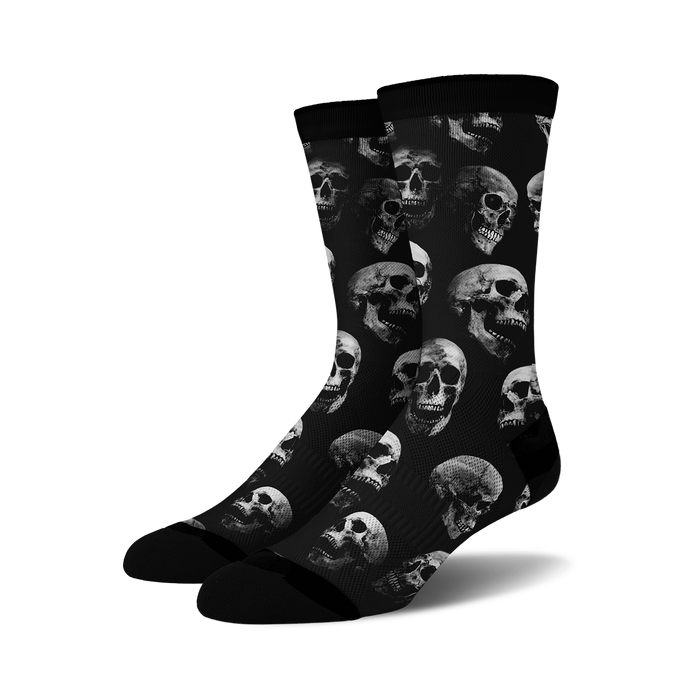 black crew socks with a pattern of white skulls.   }}