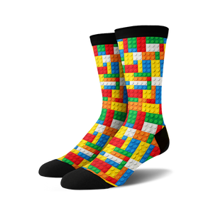Pair of crew socks with a Lego-inspired design.  The socks are predominantly red, yellow, blue, and white, with a black cuff.