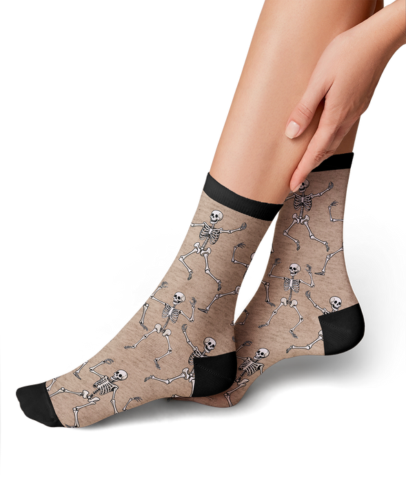 Lifestyle shot: Black 'Dead Man's Party' socks on a woman's legs.