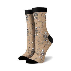 Pair of crew socks; beige and black options; dancing skeleton pattern.