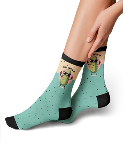 Lifestyle photo showing the 'Just Dill With It' socks on a person's feet. The socks are teal with a pickle design.