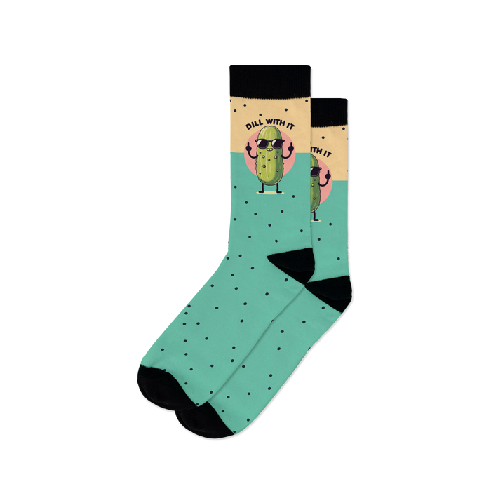 A pair of teal crew socks with a cool pickle wearing sunglasses. The socks have black polka dots and the phrase 'Just Dill With It'.