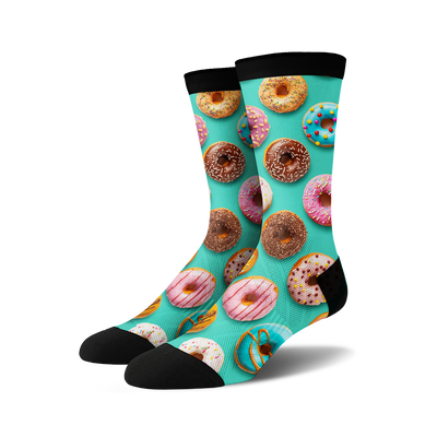 Crew socks with a teal background and colorful donut print. Donuts in pink, blue, chocolate, and yellow are depicted.