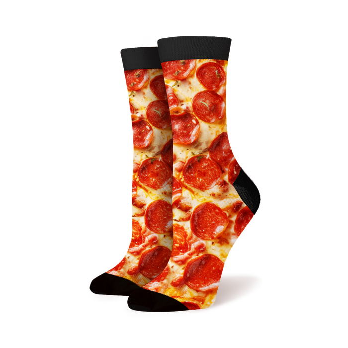 Lifestyle shot of a person wearing the pepperoni pizza socks.