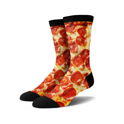 Pair of crew socks with a pepperoni pizza design. The socks are predominantly red, yellow, and black.