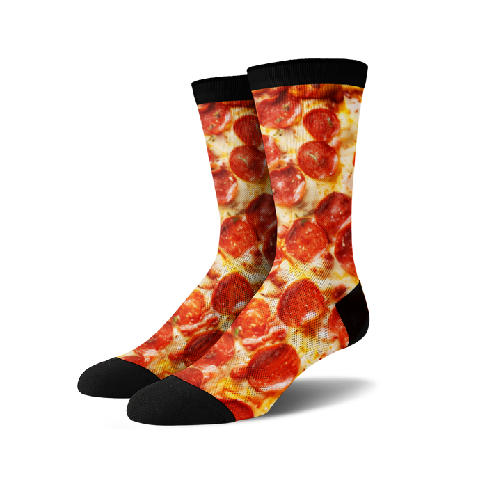 Pair of crew socks with a pepperoni pizza design.  The socks are predominantly red, yellow, and black.