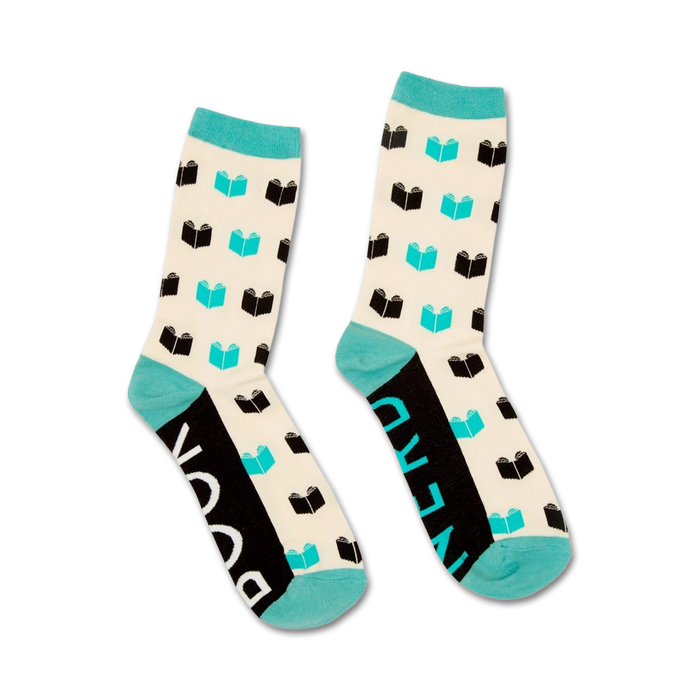Pair of cream crew socks with teal accents and a repeating pattern of black book illustrations. 'Book Nerd' is written on the cuff.