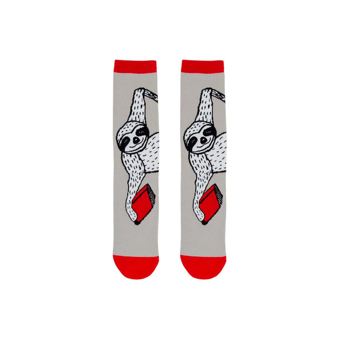 Pair of grey crew socks with a red cuff. The socks feature a design of a sloth hanging and holding a red book. }}