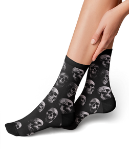 Lifestyle shot: person's legs wearing the skull socks, showing the fit and style.