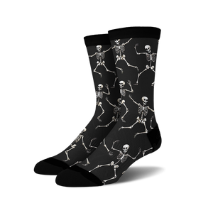 Pair of black crew socks with a fun all-over print of dancing skeletons in off-white.