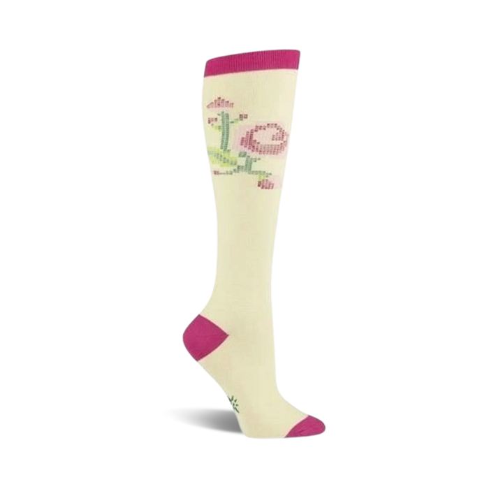 Cream knee-high socks with a stitched rose design in pink and green. Fuchsia accents at the toe and cuff. }}