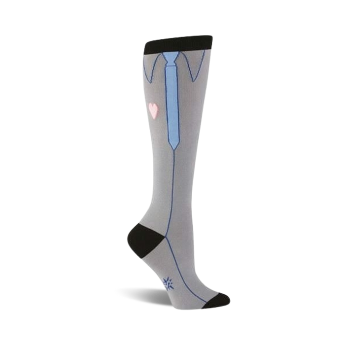 Knee-high socks in grey with a playful design featuring a light blue tie, collared shirt, and small pink heart. Black detailing at the top and bottom. }}