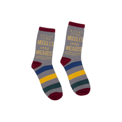 A pair of gray crew socks with maroon, blue, gold, and green stripes. The socks feature the quote: "Books turn Muggles into Wizards."