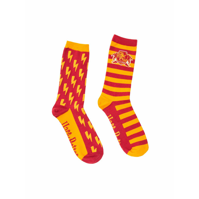 Pair of red and gold Gryffindor socks. One sock has a lightning bolt pattern, the other has the Gryffindor crest and stripes. }}