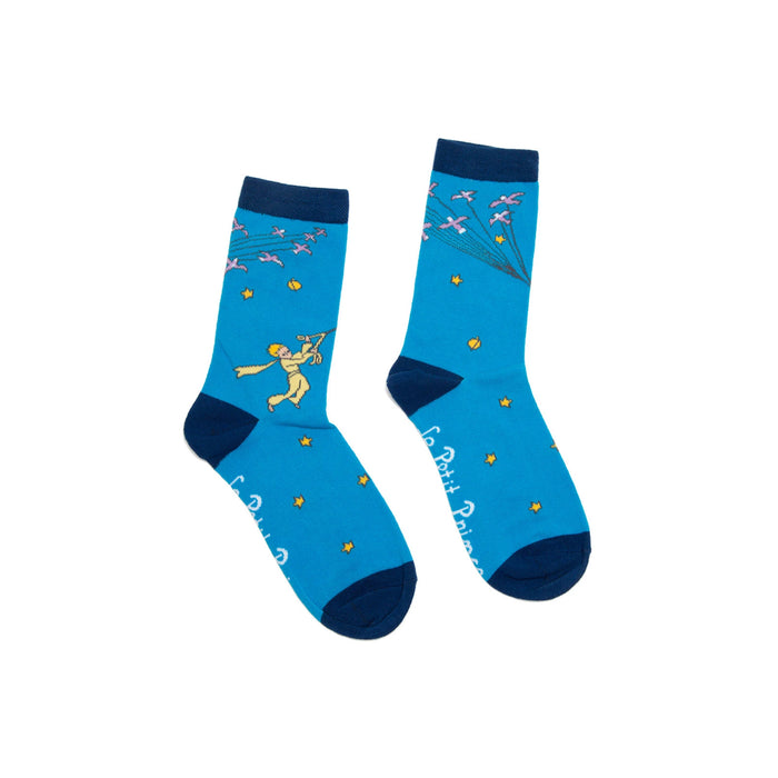 Pair of blue crew socks with navy cuffs.  Features The Little Prince illustration, flock of birds, and gold stars.  }}