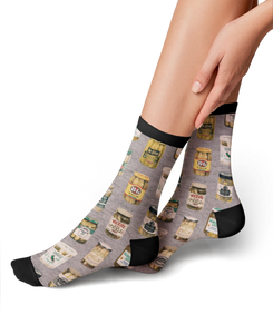 Lifestyle photo showing the Pickle Jars socks on a person's feet.