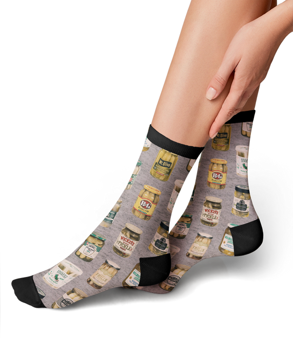 Lifestyle photo showing the Pickle Jars socks on a person's feet.