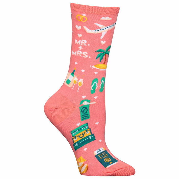 Coral pink crew socks with a honeymoon theme.  Design includes a plane, tropical island, flip-flops, champagne, wedding rings, passport, and suitcase. }}