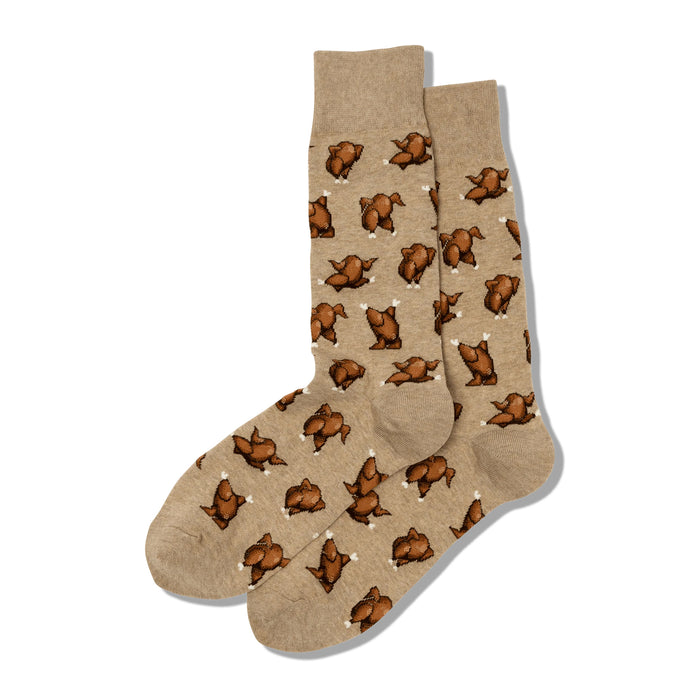 A pair of tan crew socks with a repeating pattern of brown pixelated roasted turkeys. Fun and festive! }}