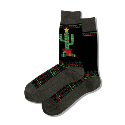 Pair of Christmas Cactus Non-Skid Slipper socks. Black with a decorated cactus image, geometric patterns, and grey cuffs.