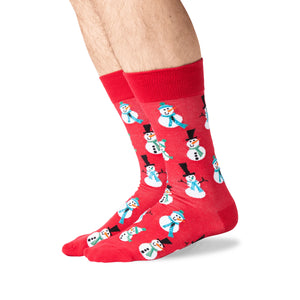 Lifestyle shot of a person's legs wearing red snowman socks.