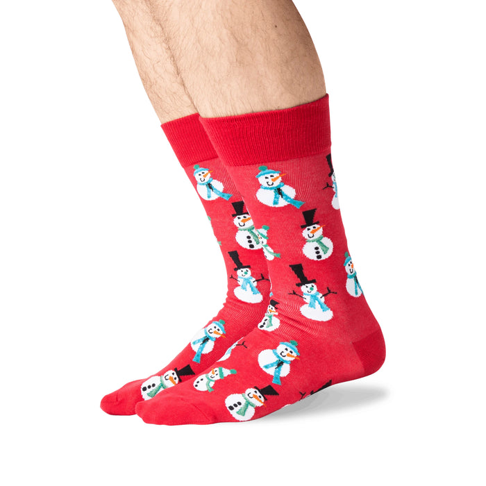 Lifestyle shot of a person's legs wearing red snowman socks.