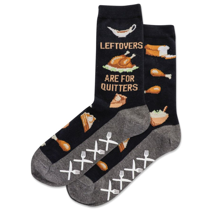 Crew socks in navy blue feature a Thanksgiving-themed pattern including turkey, pie, and bread. The saying 'Leftovers Are For Quitters' is shown. }}