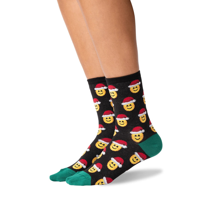 Lifestyle shot of a person wearing the Santa Smile Emoji socks. Shows how the socks look on the feet.