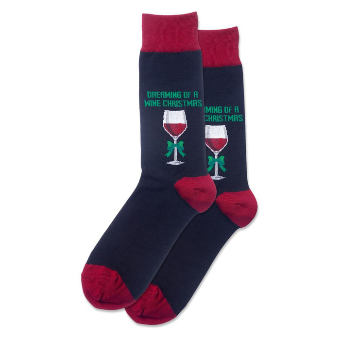 Pair of navy blue crew socks with burgundy cuffs.  Each sock shows a red wine glass with a green bow and the text 'Dreaming of a Wine Christmas'. }}